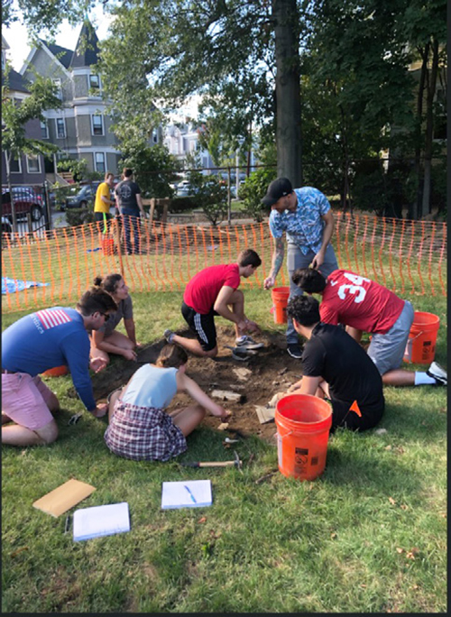 Students participating in guided excavation