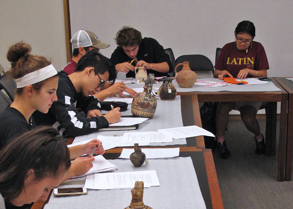 Students drawing objects from JIAAW Collection