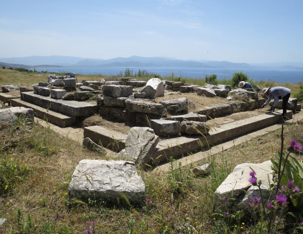 Stones at an archaeological site, in front of the sea