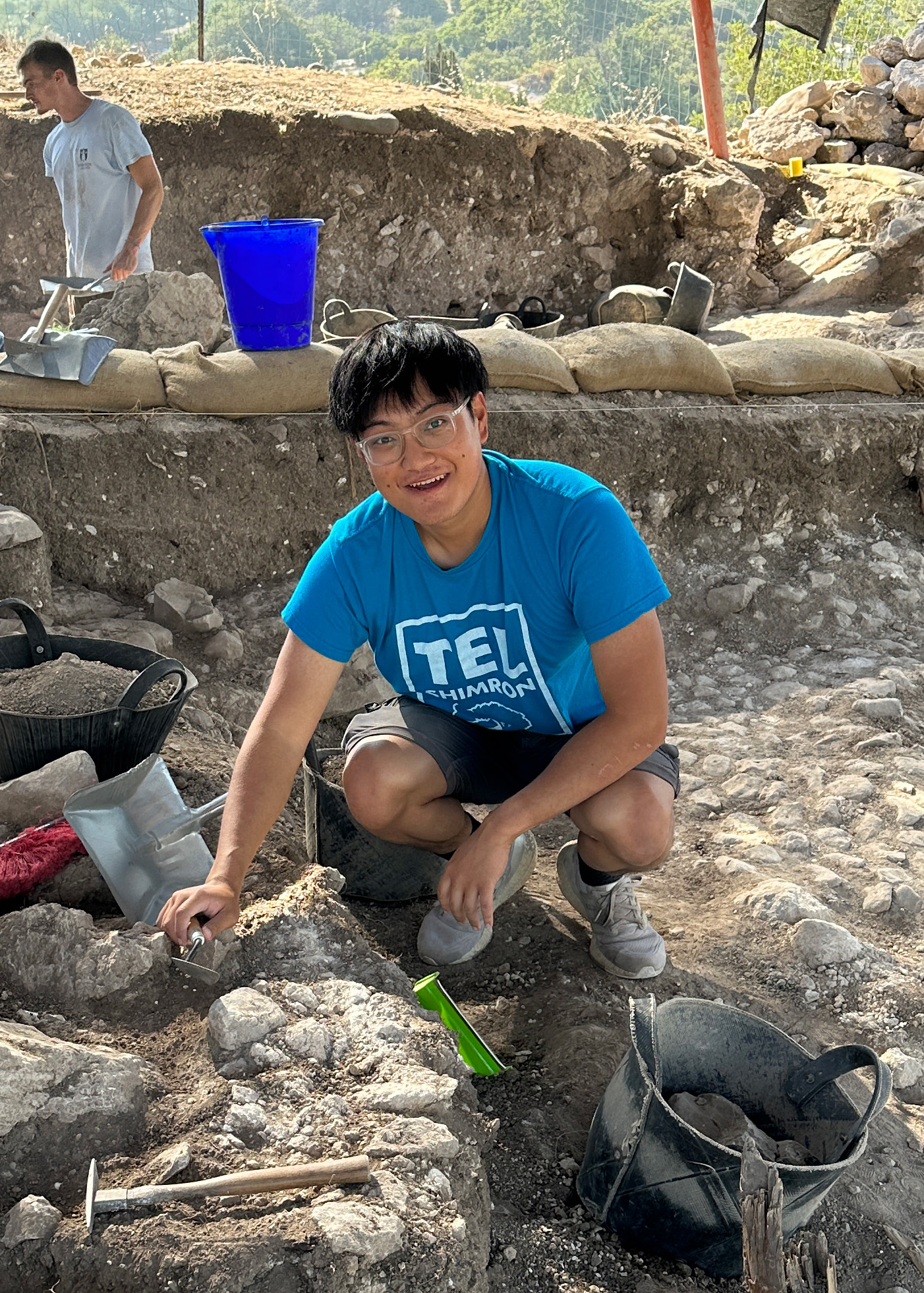 Alex Zeng at an excavation site